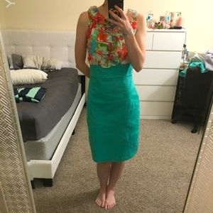 Teal knee-length dress with ruffles